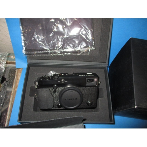 357 - A Fuji X-pro 1 digital camera body and numerous accessories, all assessed by WEX photo as 9+ conditi... 