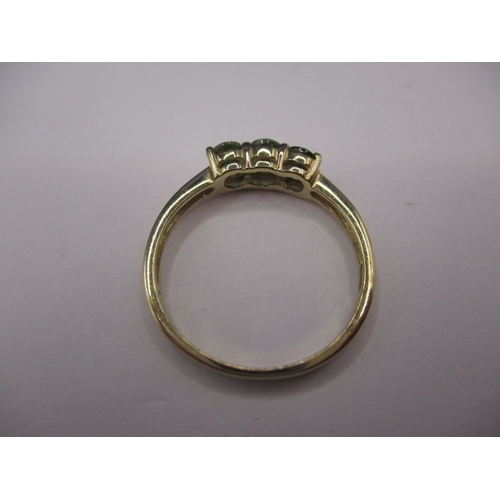 30 - A 9ct yellow gold dress ring with 3 Madagascan green garnets, approx. ring size ‘N’, approx. weight ... 