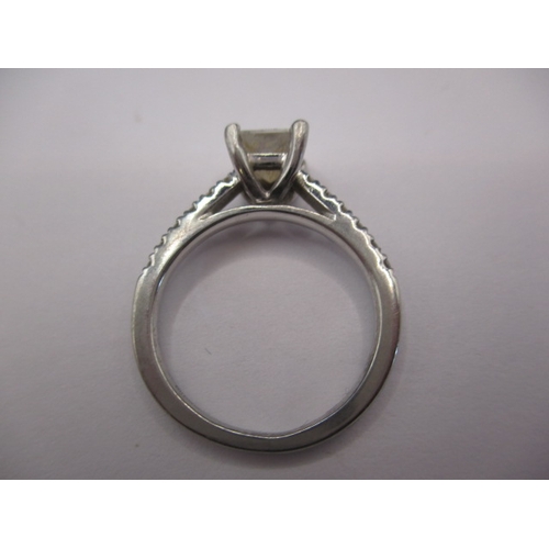 64 - A pair of 950 platinum and diamond rings, both approx. ring size of ‘J’ the central square cut stone... 