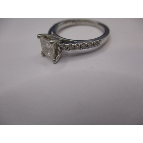 64 - A pair of 950 platinum and diamond rings, both approx. ring size of ‘J’ the central square cut stone... 