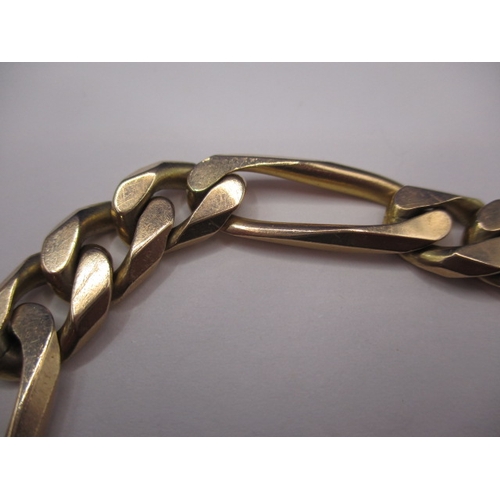 102 - A 9ct yellow gold solid flat curb and paperclip link bracelet, in good used condition with working c... 