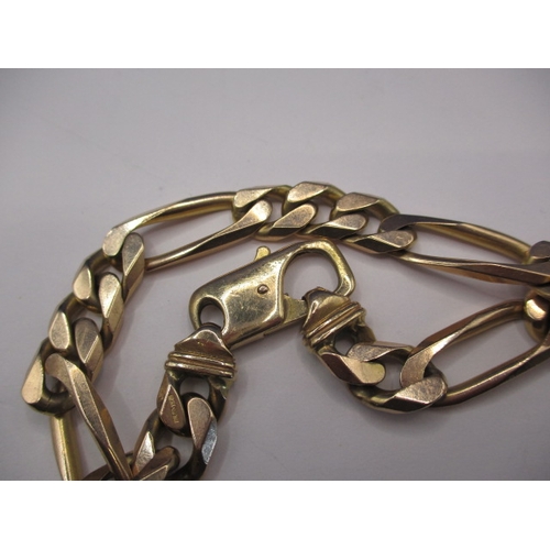 102 - A 9ct yellow gold solid flat curb and paperclip link bracelet, in good used condition with working c... 