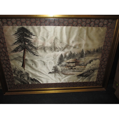 299 - A large Japanese silk landscape scene, in glazed frame approx. frame size 114x81cm