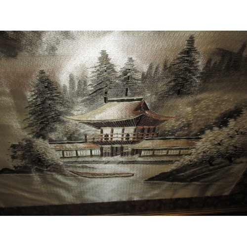 299 - A large Japanese silk landscape scene, in glazed frame approx. frame size 114x81cm