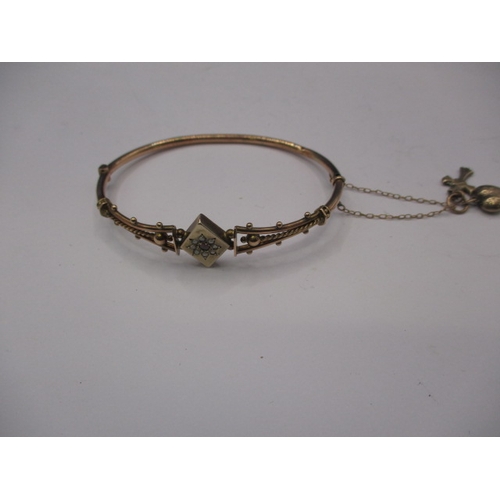 113 - An antique 9ct rose gold bangle, approx. weight 6.8g in good pre-owned condition with working clasp ... 