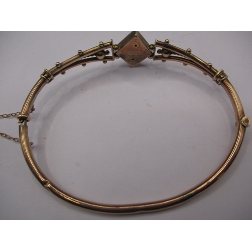 113 - An antique 9ct rose gold bangle, approx. weight 6.8g in good pre-owned condition with working clasp ... 