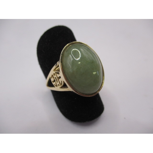 69 - A 14ct yellow gold and jade cabochon dress ring, approx. ring size ‘M’ approx. gross weight 4.5g in ... 