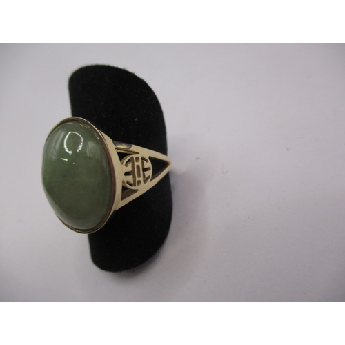 69 - A 14ct yellow gold and jade cabochon dress ring, approx. ring size ‘M’ approx. gross weight 4.5g in ... 