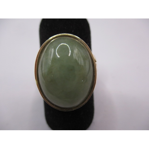 69 - A 14ct yellow gold and jade cabochon dress ring, approx. ring size ‘M’ approx. gross weight 4.5g in ... 