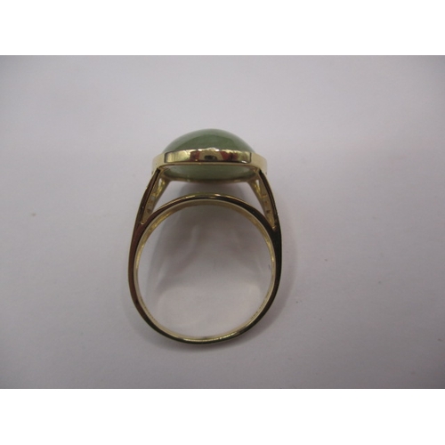 69 - A 14ct yellow gold and jade cabochon dress ring, approx. ring size ‘M’ approx. gross weight 4.5g in ... 