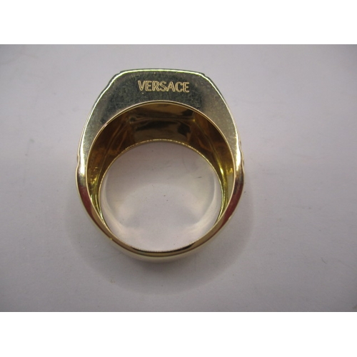 70 - A Versace 18ct yellow gold signet ring, approx. ring size ‘X’, approx. weight 16.6g, in pre-owned ne... 