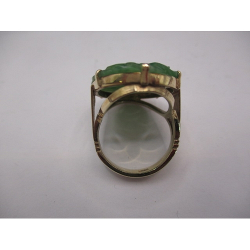 38 - A 9ct yellow gold ring with lotus blossom carved jade panel 20x30mm, approx. ring size ‘O’ approx. w... 