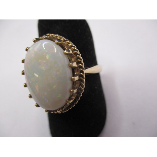 39 - A vintage 9ct gold and opal ring, the cabochon opal measuring approx. 14x10mm, approx. ring size ‘M’... 