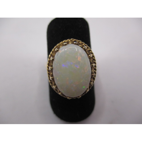 39 - A vintage 9ct gold and opal ring, the cabochon opal measuring approx. 14x10mm, approx. ring size ‘M’... 