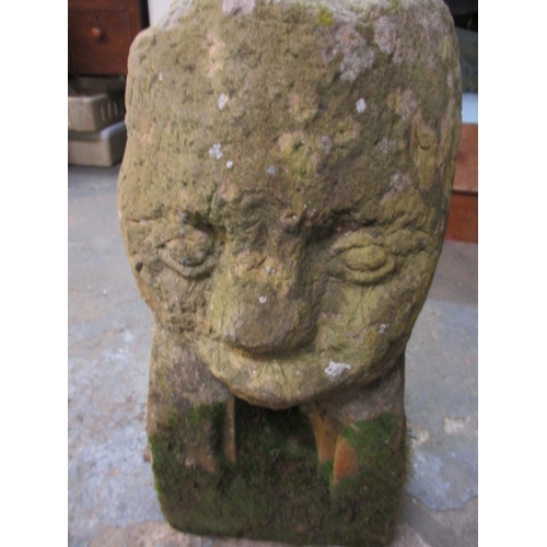 327 - A medieval carved stone head, approx. height 60cm, family legend relates to this being removed in th... 