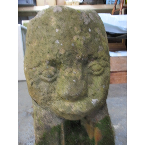 327 - A medieval carved stone head, approx. height 60cm, family legend relates to this being removed in th... 