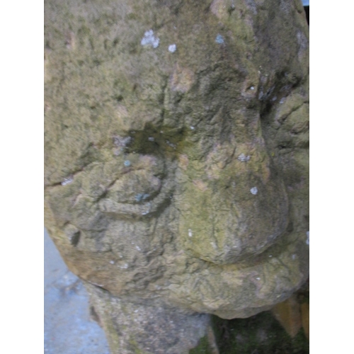 327 - A medieval carved stone head, approx. height 60cm, family legend relates to this being removed in th... 