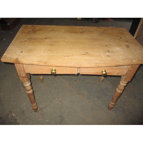 303 - An early 20th century waxed pine desk, with removable top rack, in good used condition