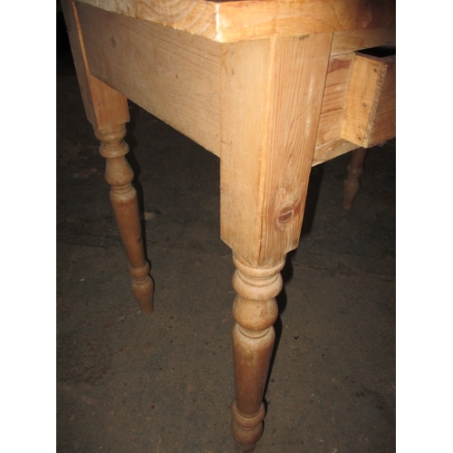 303 - An early 20th century waxed pine desk, with removable top rack, in good used condition