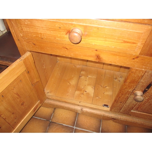 317 - A vintage natural pine kitchen dresser with glazed top rack with drawers and cupboards to base, in g... 