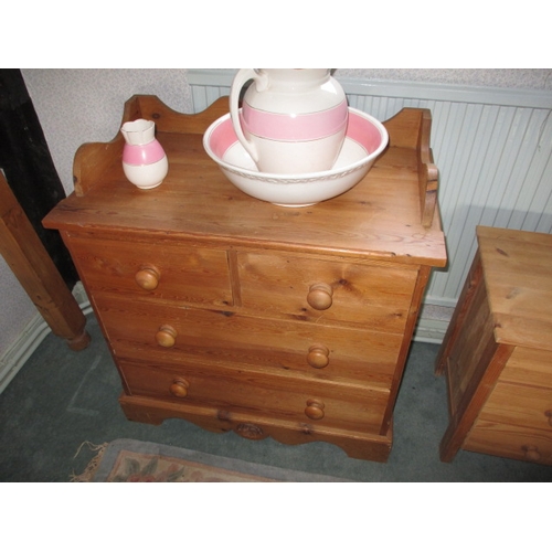 309 - A vintage pine wash stand with 2 short over 2 long drawers and an associated jug and bowl, in functi... 