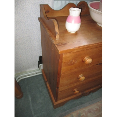 309 - A vintage pine wash stand with 2 short over 2 long drawers and an associated jug and bowl, in functi... 