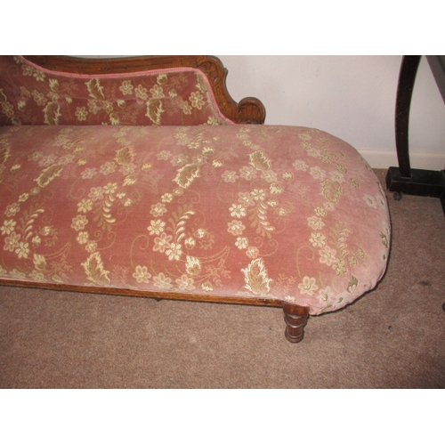 330 - A late 19th century day bed with carved walnut frame and red upholstery, in good used condition. App... 