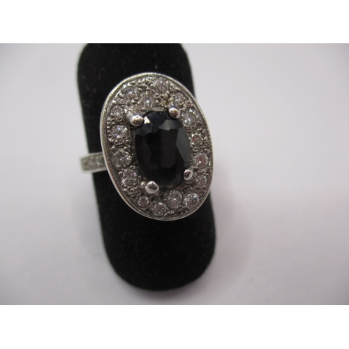 71 - A 9ct white gold diamond and sapphire ring, approx. ring size ‘O’, approx. weight 5.6g, having diamo... 