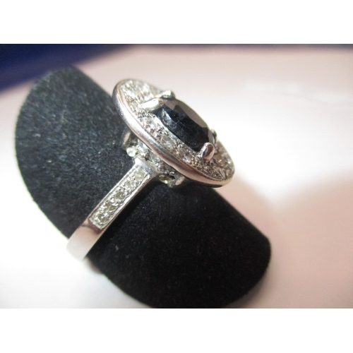 71 - A 9ct white gold diamond and sapphire ring, approx. ring size ‘O’, approx. weight 5.6g, having diamo... 