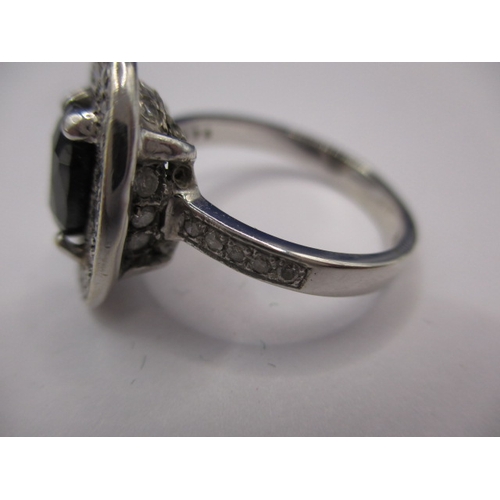 71 - A 9ct white gold diamond and sapphire ring, approx. ring size ‘O’, approx. weight 5.6g, having diamo... 