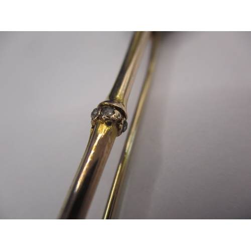 119 - A large antique 15ct gold stick pin with Essex crystal floral head and diamond set shaft, approx. le... 