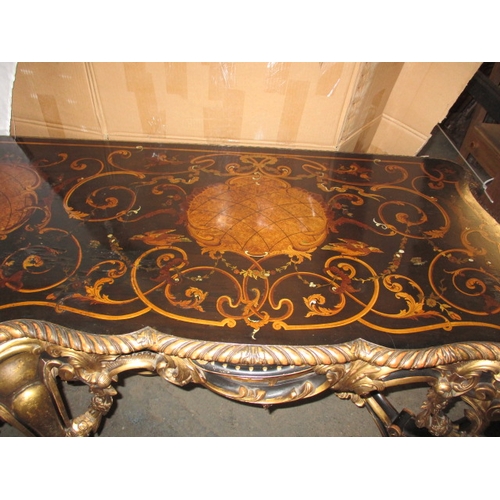 301 - A late 19th  early 20th Century ebonised and gilt wood inlaid corner table, having various woods and... 