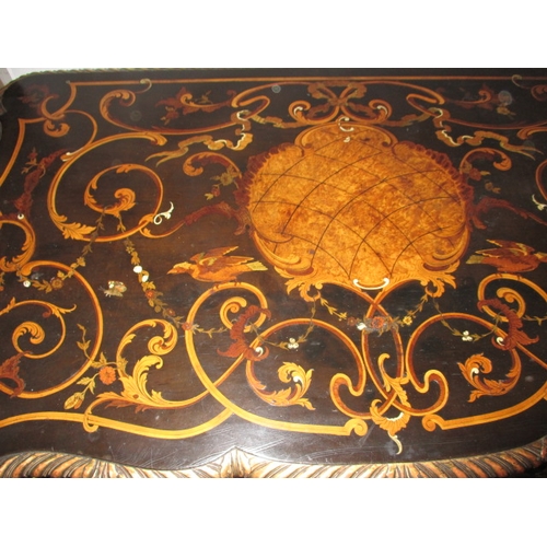 301 - A late 19th  early 20th Century ebonised and gilt wood inlaid corner table, having various woods and... 