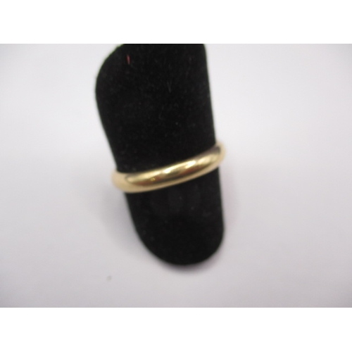 73 - A 750 yellow gold wedding band, approx. ring size ‘M’, approx. width 3.1mm, approx. weight 3g in goo... 