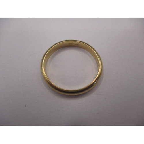 73 - A 750 yellow gold wedding band, approx. ring size ‘M’, approx. width 3.1mm, approx. weight 3g in goo... 