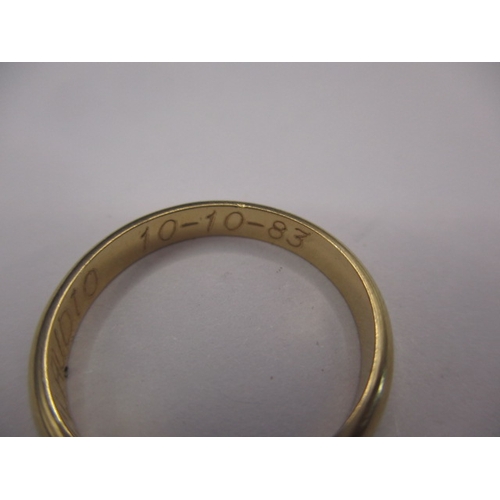 73 - A 750 yellow gold wedding band, approx. ring size ‘M’, approx. width 3.1mm, approx. weight 3g in goo... 