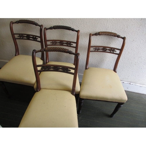 A set of 4, 19th century mahogany dining chairs with carved and turned decoration, all in good useable condition with use-related marks, approx. height to pad top 43cm