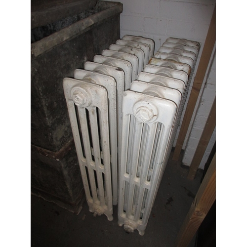 319 - Two early 20th century cast iron radiators, both in used condition and not tested as to function, on... 