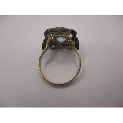 22 - An antique 15ct yellow gold and silver ring with central aquamarine surrounded by small old cut diam... 