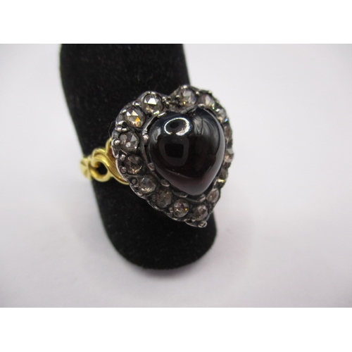 34 - An antique 15ct gold ring with heart shaped garnet surrounded by old cut diamonds, approx. ring size... 