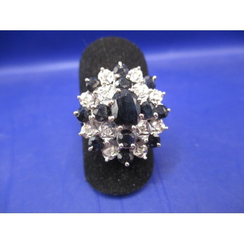 A 9ct yellow gold diamond and sapphire cluster ring, approx. ring size ‘P’, in good pre-owned condition