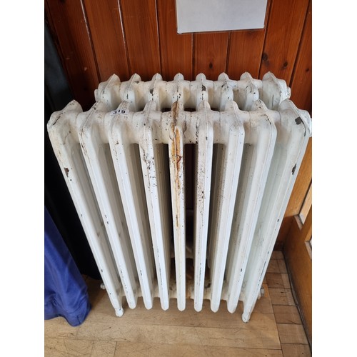 319 - Two early 20th century cast iron radiators, both in used condition and not tested as to function, on... 