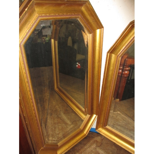 21 - Two contemporary bevelled edge gilt framed wall mirrors, approx. sizes 72x41cm & 72x56cm both in goo... 