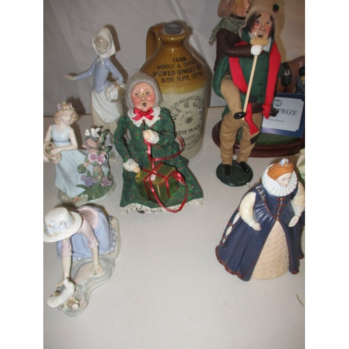 61 - A quantity of figurines to include Royal Doulton and Nao examples. In used condition