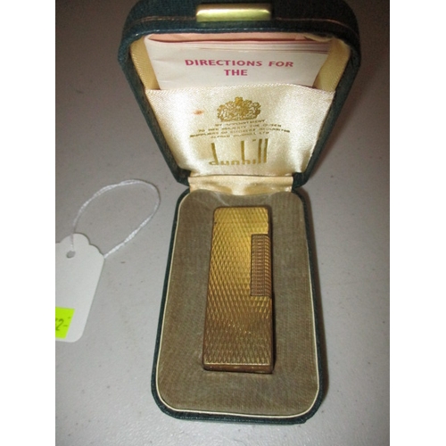 62 - A boxed vintage Dunhill lighter, not tested to function, with general use related marks and original... 