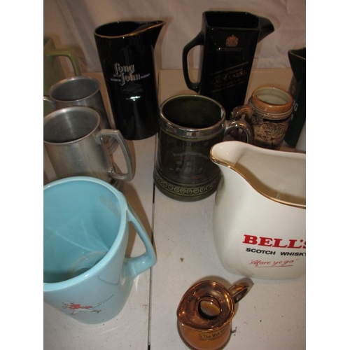 64 - A collection of pub water jugs, with examples by Wade. In used condition, one with a chip to top rim