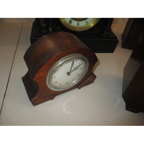 65 - 4 vintage clocks to include a slate example. Not tested as to functioning