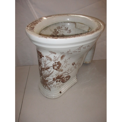 A Victorian water closet base, with floral polychrome decoration. With some damages to base fixings