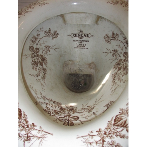 72 - A Victorian water closet base, with floral polychrome decoration. With some damages to base fixings