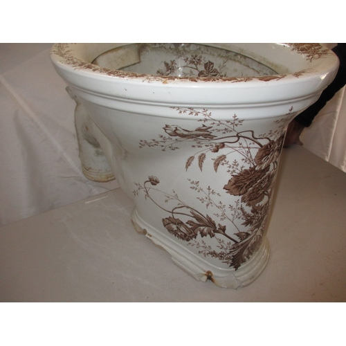 72 - A Victorian water closet base, with floral polychrome decoration. With some damages to base fixings